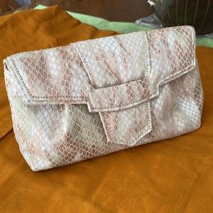 Animal print small shoulder strap bag man made material.